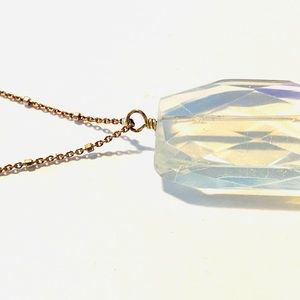Clear crystal quartz on sterling chain with tiny beads reflecting light